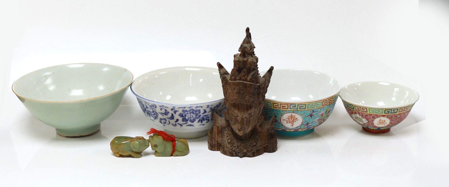 Four Oriental bowls , two hardstone pigs and a Thai carving